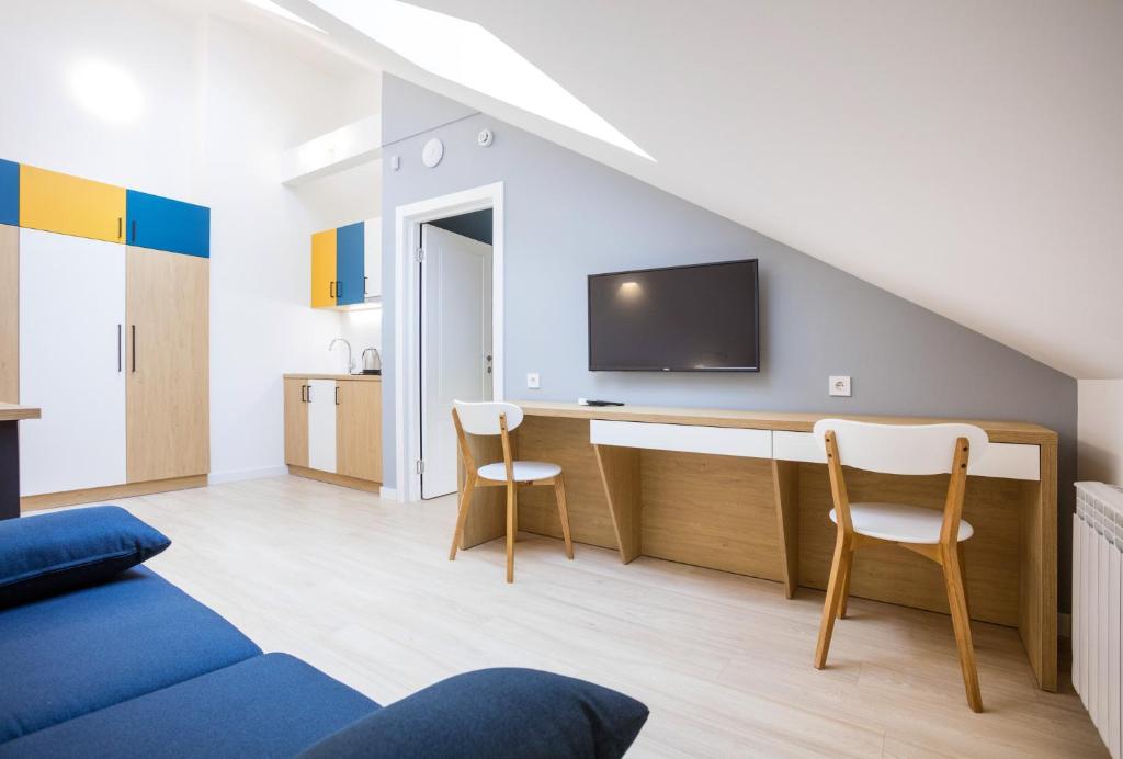 TV a/nebo společenská místnost v ubytování Partner Guest House Baseina