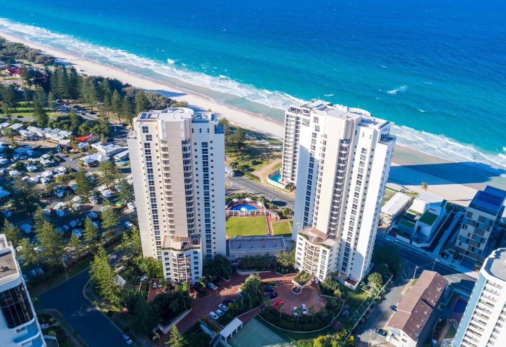 an aerial view of a beach with tall buildings and the ocean at Xanadu Resort in Gold Coast