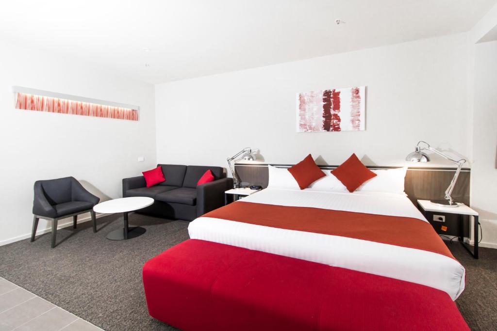 
A bed or beds in a room at Abode Woden
