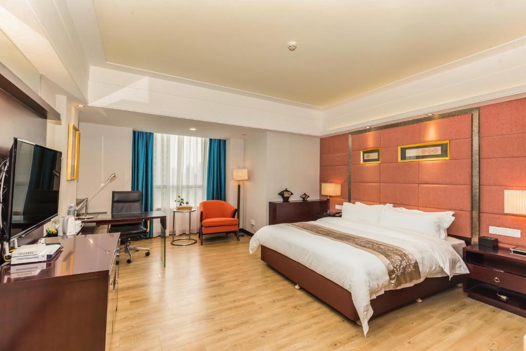 TV a/nebo společenská místnost v ubytování Foshan Rezen Select Pasonda Hotel