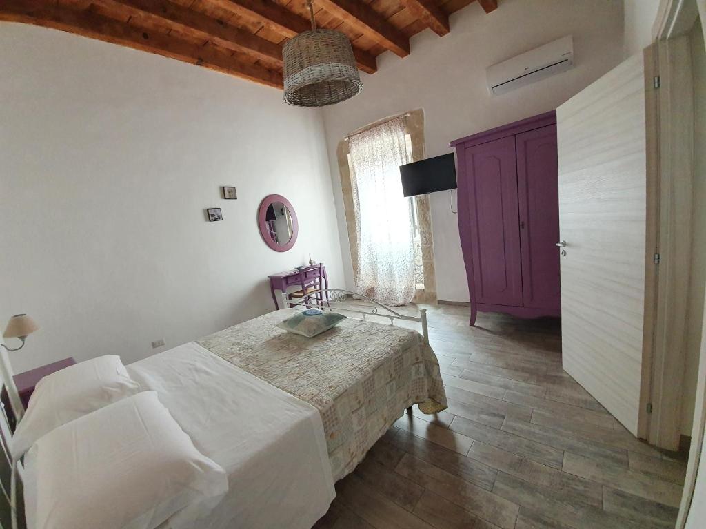 Postel nebo postele na pokoji v ubytování B&B La Terrazza di NonnAnna