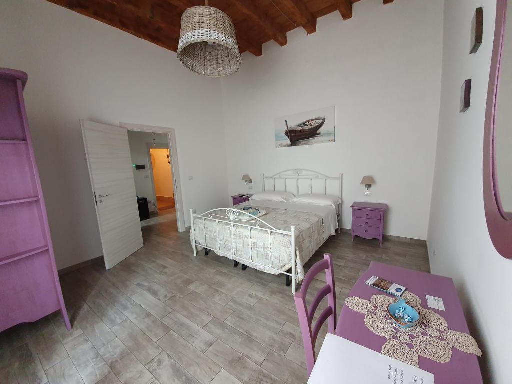 Postel nebo postele na pokoji v ubytování B&B La Terrazza di NonnAnna