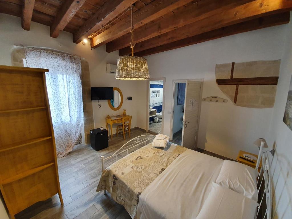 Postel nebo postele na pokoji v ubytování B&B La Terrazza di NonnAnna