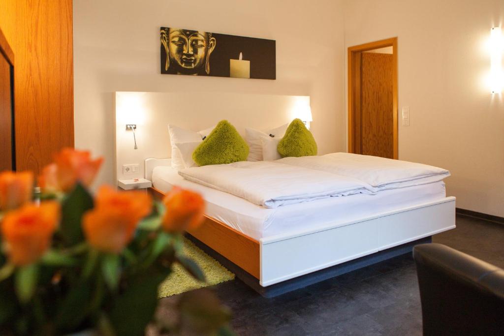 Postel nebo postele na pokoji v ubytování Hotel Am Grudenberg