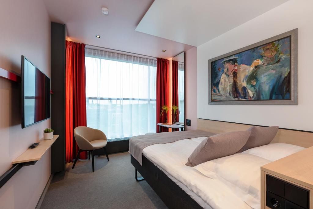 Voodi või voodid majutusasutuse Art Hotel Pallas by Tartuhotels toas
