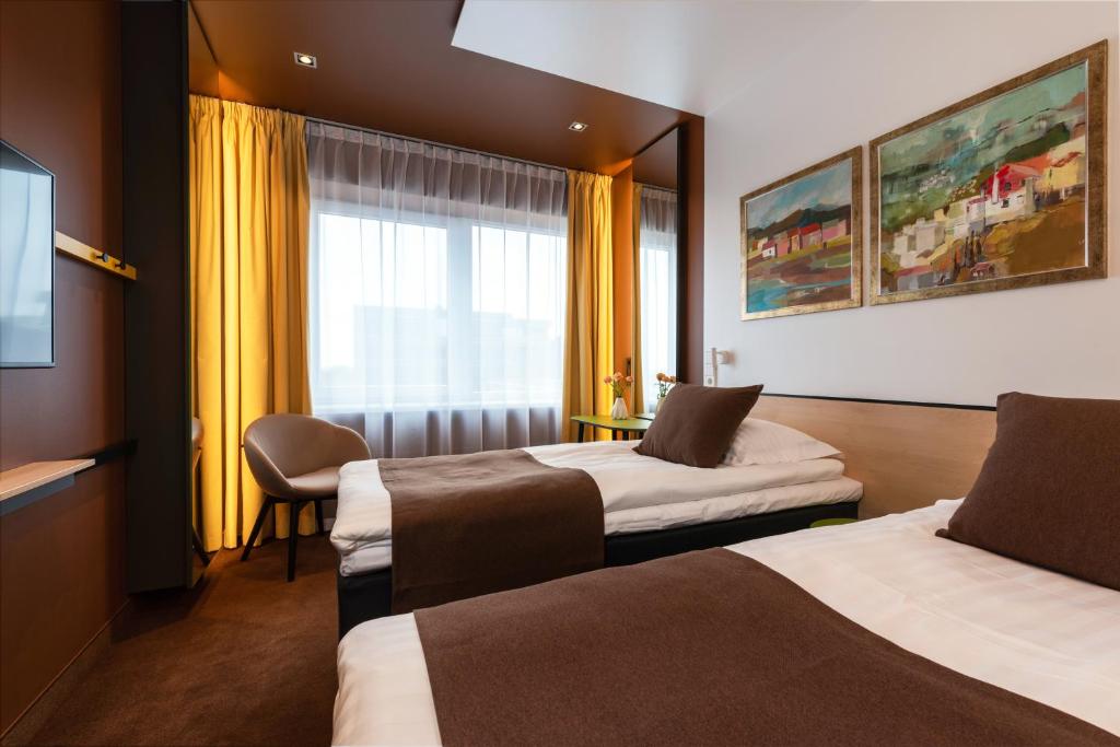 Voodi või voodid majutusasutuse Art Hotel Pallas by Tartuhotels toas