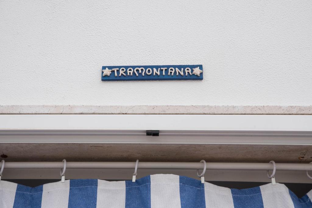 a sign that reads transport firm on a wall at Villa Lara in Polignano a Mare
