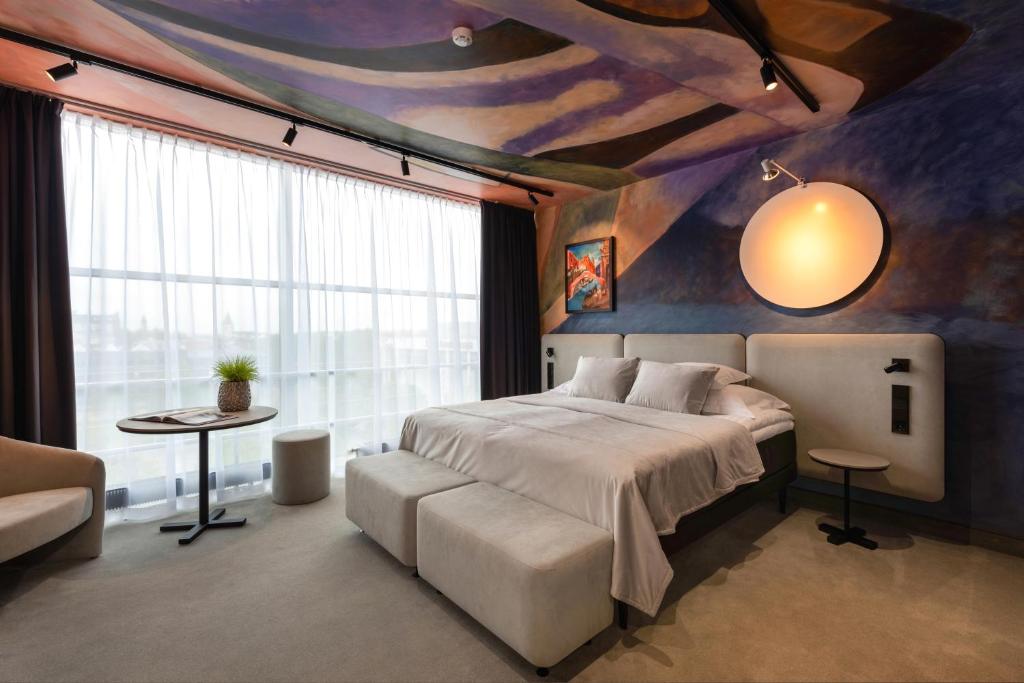 Voodi või voodid majutusasutuse Art Hotel Pallas by Tartuhotels toas