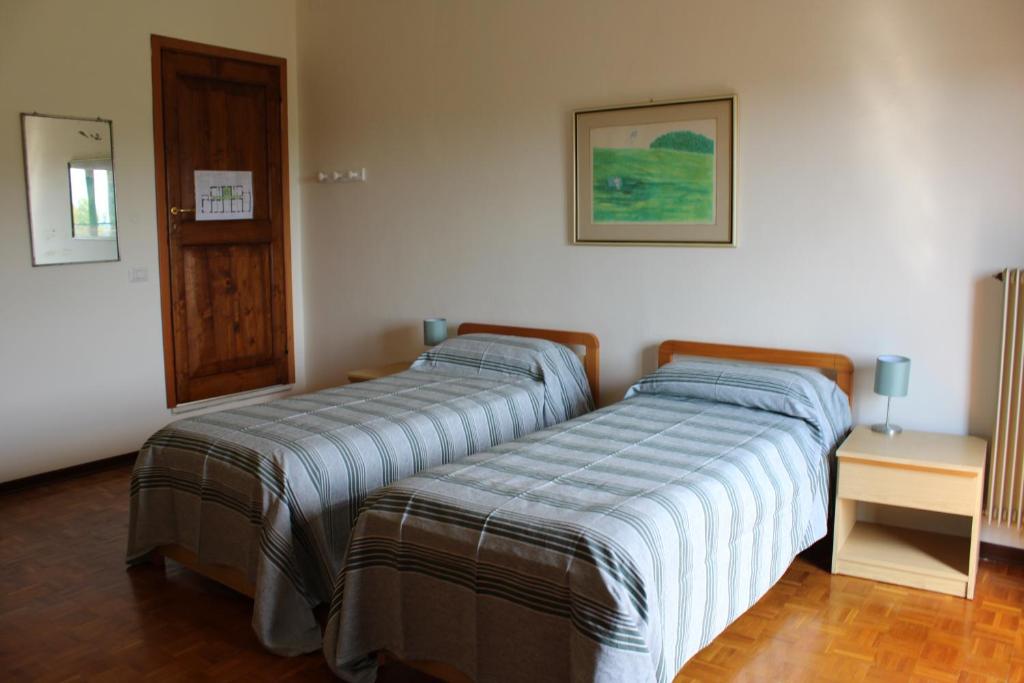 Postel nebo postele na pokoji v ubytování Villa Flangini