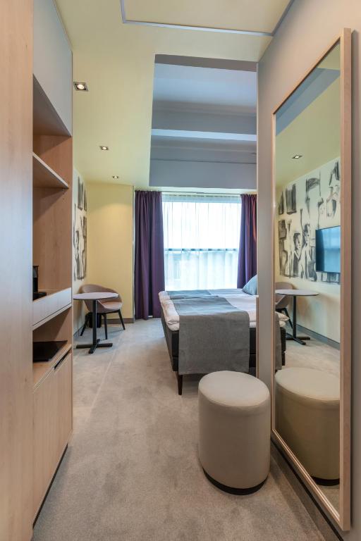 Televiisor ja/või meelelahutuskeskus majutusasutuses Art Hotel Pallas by Tartuhotels