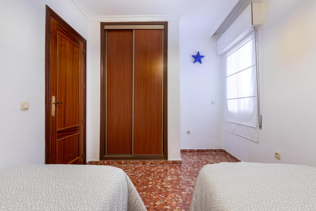 Posteľ alebo postele v izbe v ubytovaní Apartamento Cala Mar
