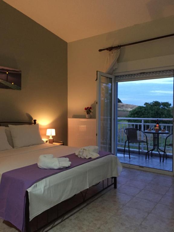 A bed or beds in a room at My Lemnos Studios - Studio 4