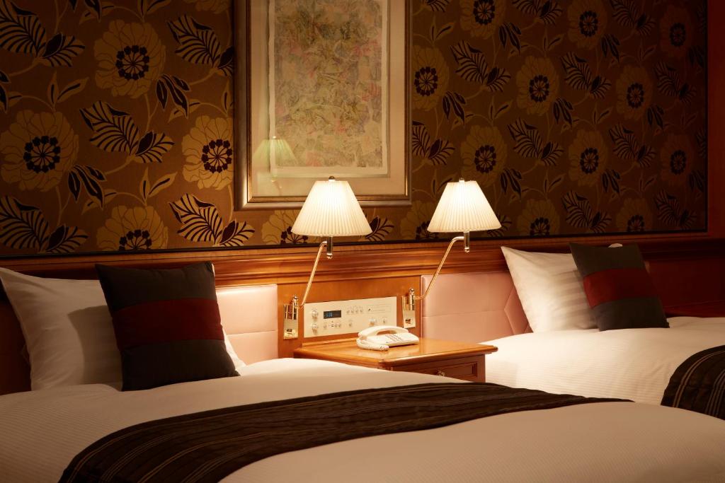 Postel nebo postele na pokoji v ubytování Hotel Agora Regency Osaka Sakai