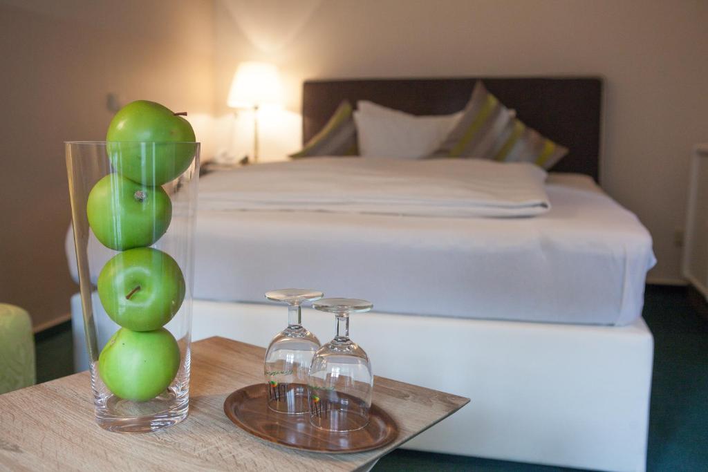 Postel nebo postele na pokoji v ubytování Hotel Am Grudenberg