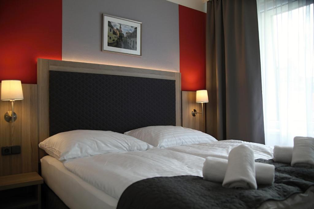 Postel nebo postele na pokoji v ubytování Hotel CK Park
