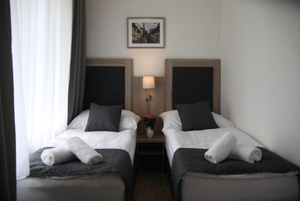 Postel nebo postele na pokoji v ubytování Hotel CK Park