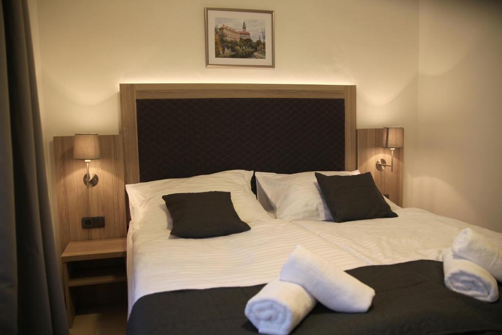 Postel nebo postele na pokoji v ubytování Hotel CK Park