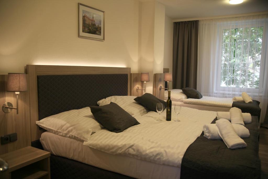 Postel nebo postele na pokoji v ubytování Hotel CK Park