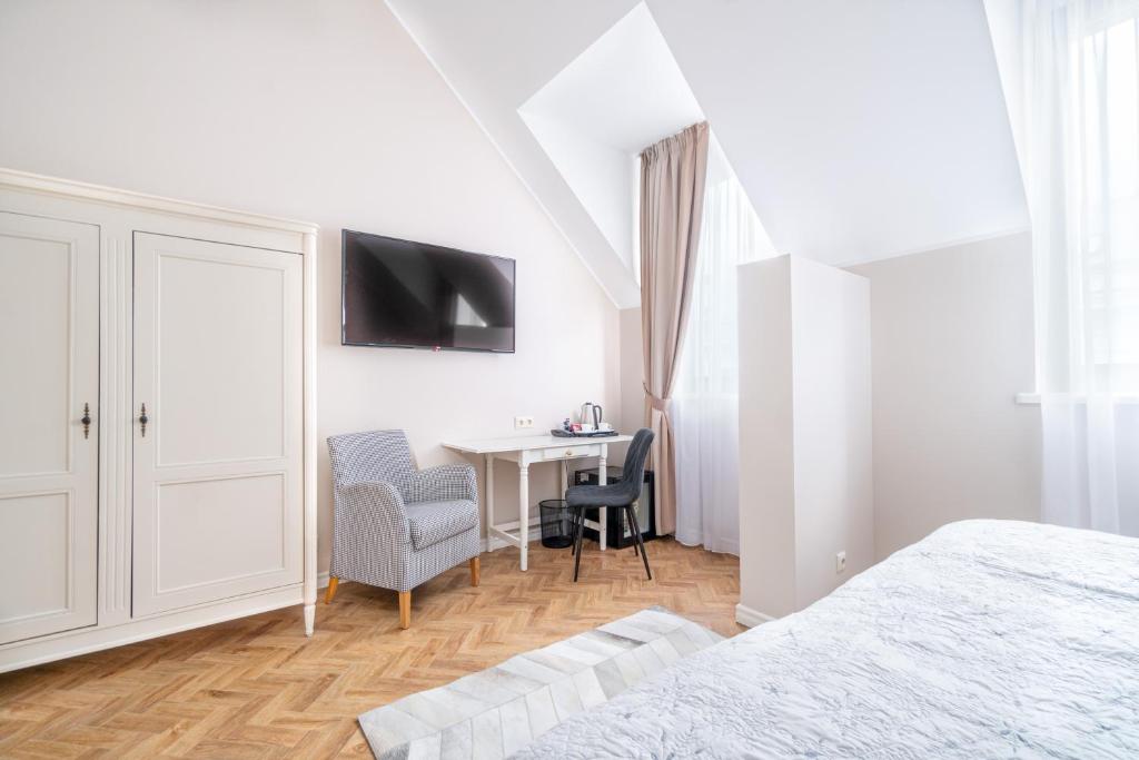 Postel nebo postele na pokoji v ubytování Forums Boutique Hotel