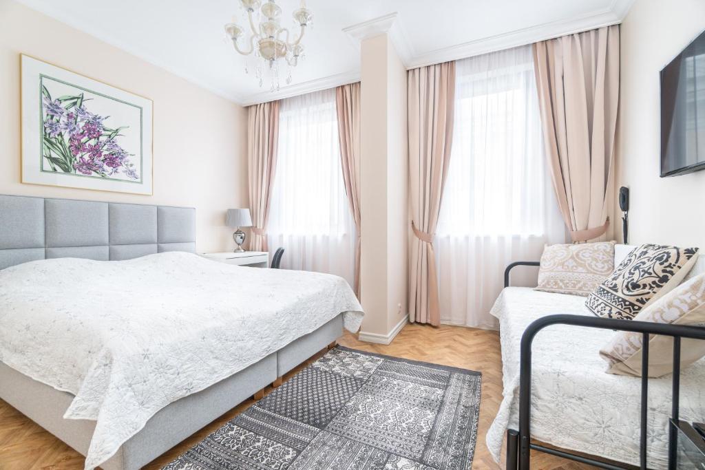 Postel nebo postele na pokoji v ubytování Forums Boutique Hotel