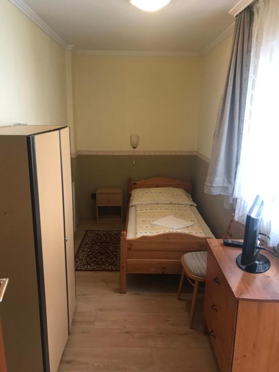 Postel nebo postele na pokoji v ubytování Taverna panzió