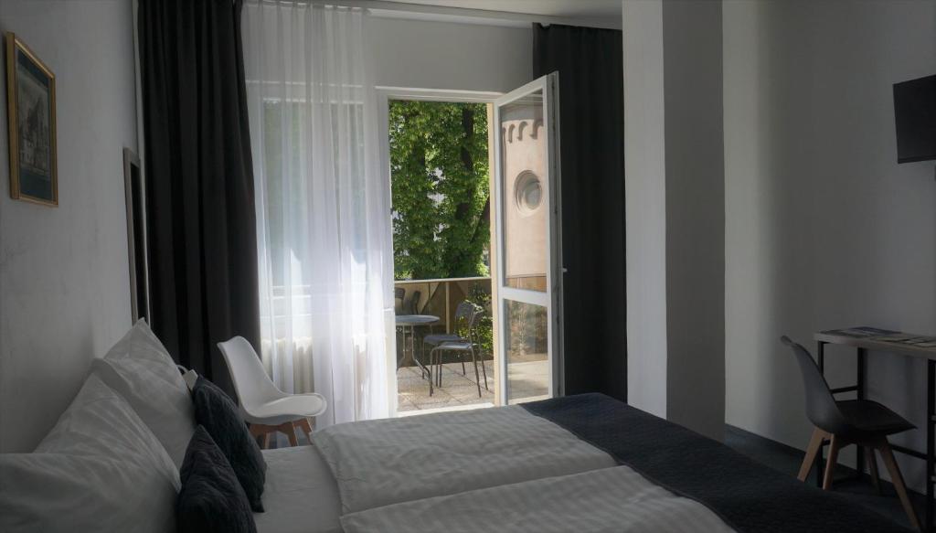 Postel nebo postele na pokoji v ubytování Hotel Metropol CB