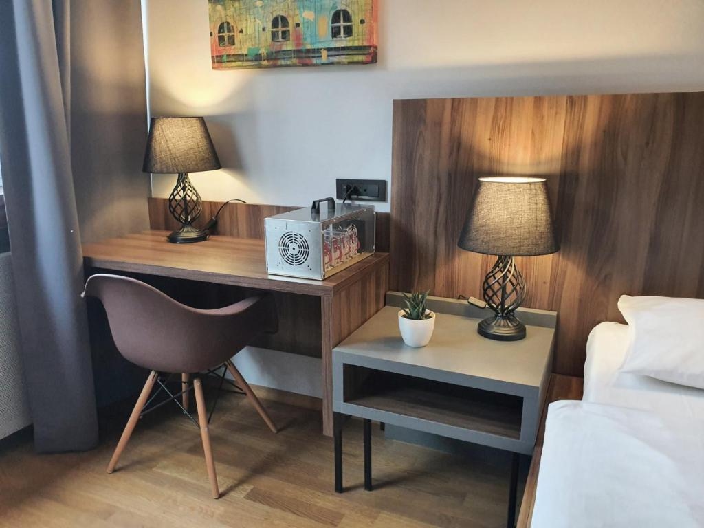 Postelja oz. postelje v sobi nastanitve Atelier Hotel