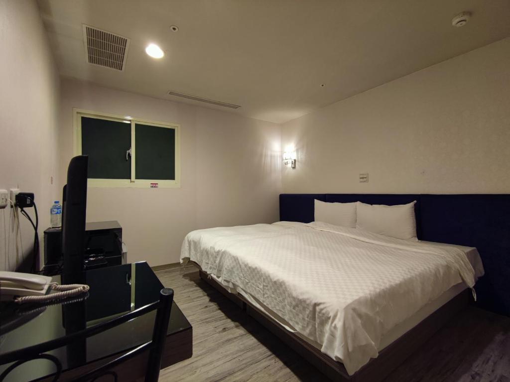 Postel nebo postele na pokoji v ubytování Walker Hotel - Zhengyi
