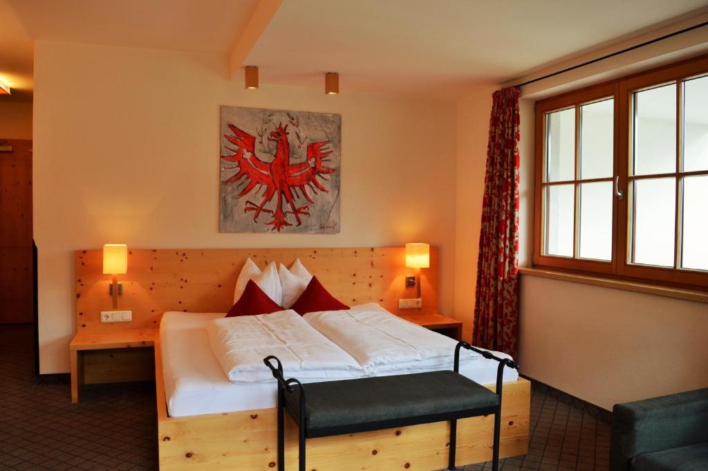 Postel nebo postele na pokoji v ubytování Hotel Garni Frommes