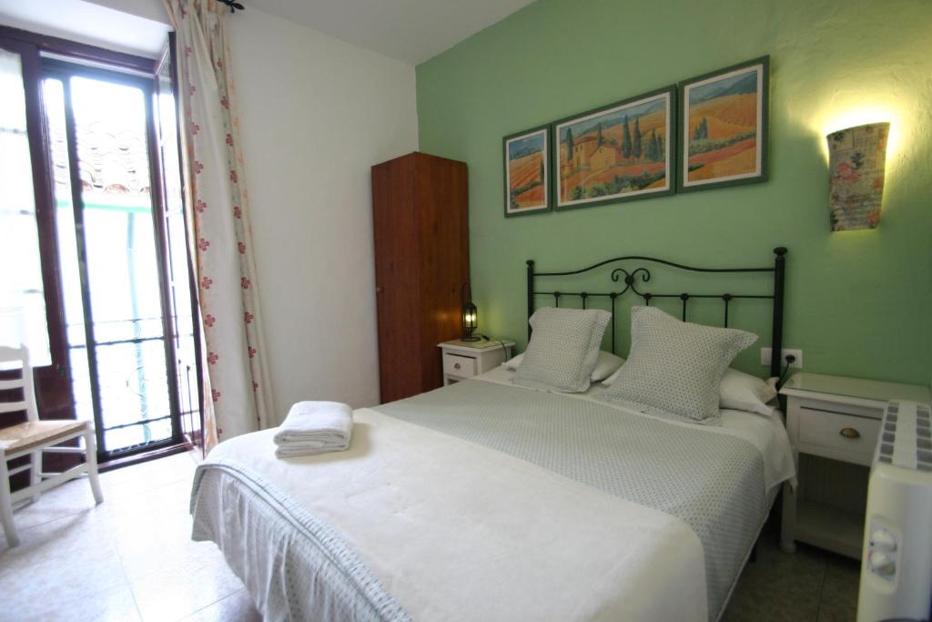 Cama o camas de una habitación en Pension el Portillo