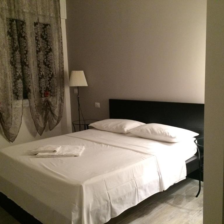 A bed or beds in a room at Affittacamere Real Fly