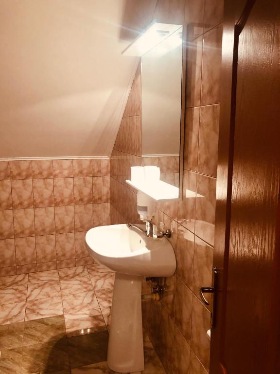 Koupelna v ubytování Hotel Poenita