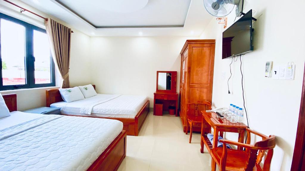 Postel nebo postele na pokoji v ubytování Khách sạn Phúc Lộc An Côn Đảo