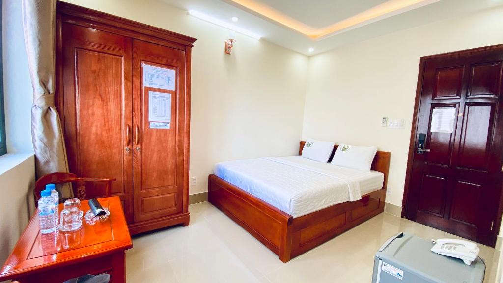 Postel nebo postele na pokoji v ubytování Khách sạn Phúc Lộc An Côn Đảo
