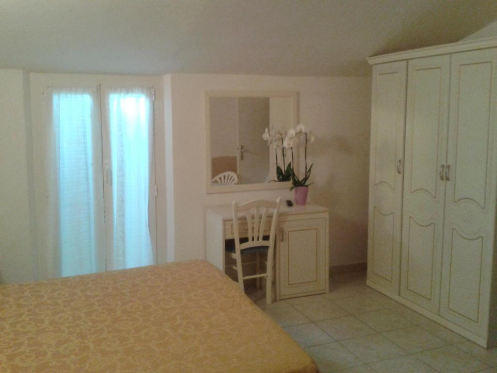 Postel nebo postele na pokoji v ubytování Albergo Villa Aida