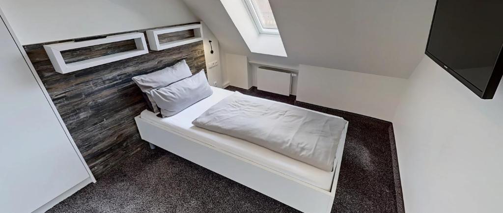 Postel nebo postele na pokoji v ubytování Boardinghouse Emden