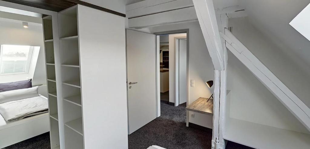 Postel nebo postele na pokoji v ubytování Boardinghouse Emden