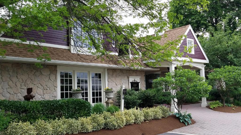 a house with a brick driveway in front of it at The Inn at Leola Village, a Historic Hotel of America in Lancaster