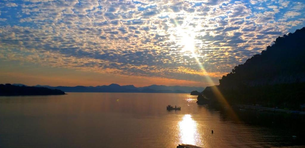 a sunset over a large body of water at Villa Anita in Sobra