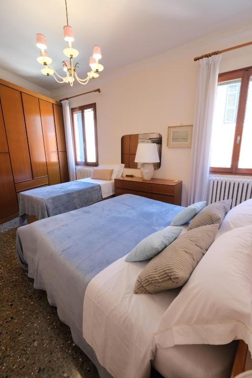 A bed or beds in a room at Venice Life