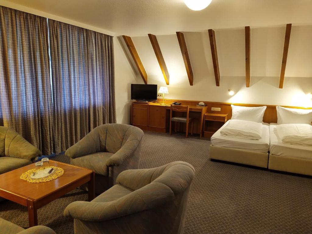 Postel nebo postele na pokoji v ubytování Hotel Faller