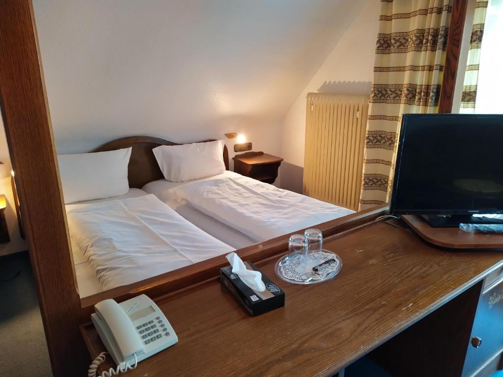 Postel nebo postele na pokoji v ubytování Hotel Faller