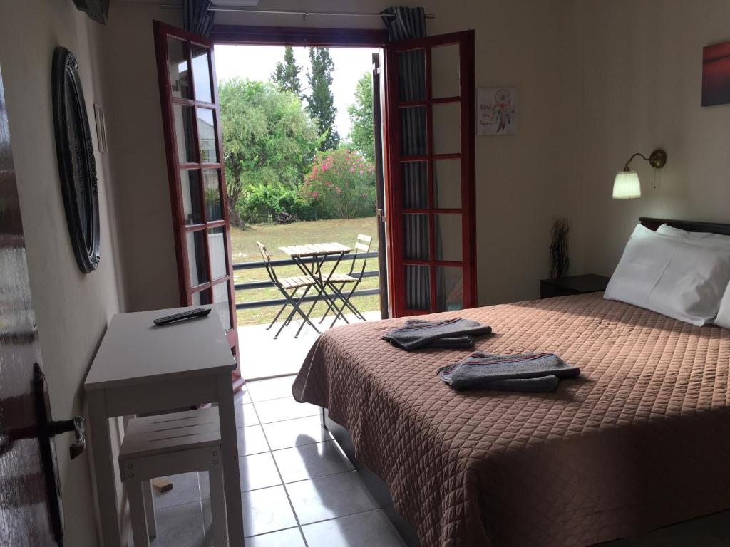 Postel nebo postele na pokoji v ubytování Alexander Apartments
