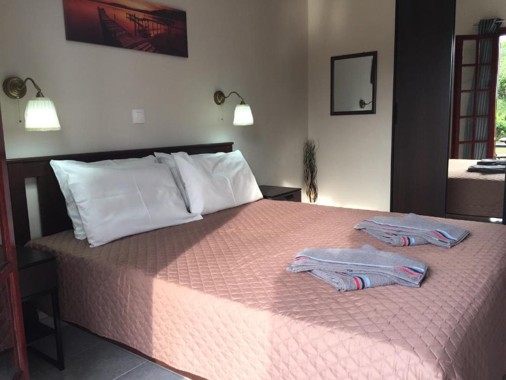 Postel nebo postele na pokoji v ubytování Alexander Apartments
