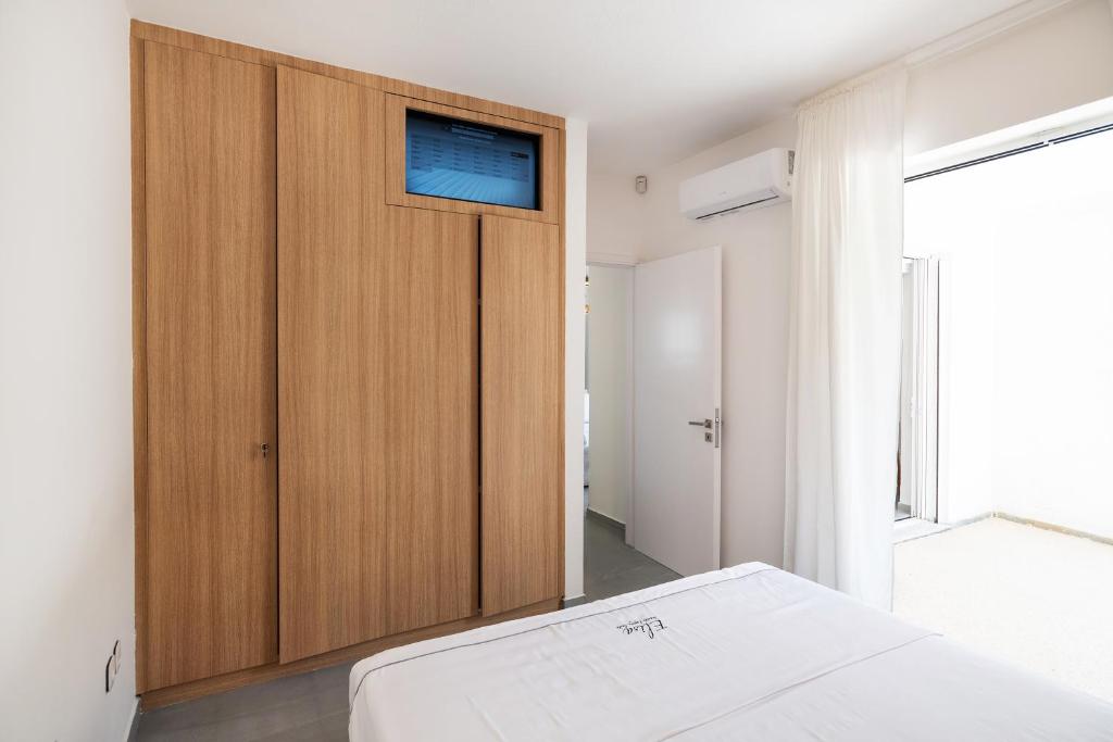 Postel nebo postele na pokoji v ubytování Elisa Seaside Luxury Suite