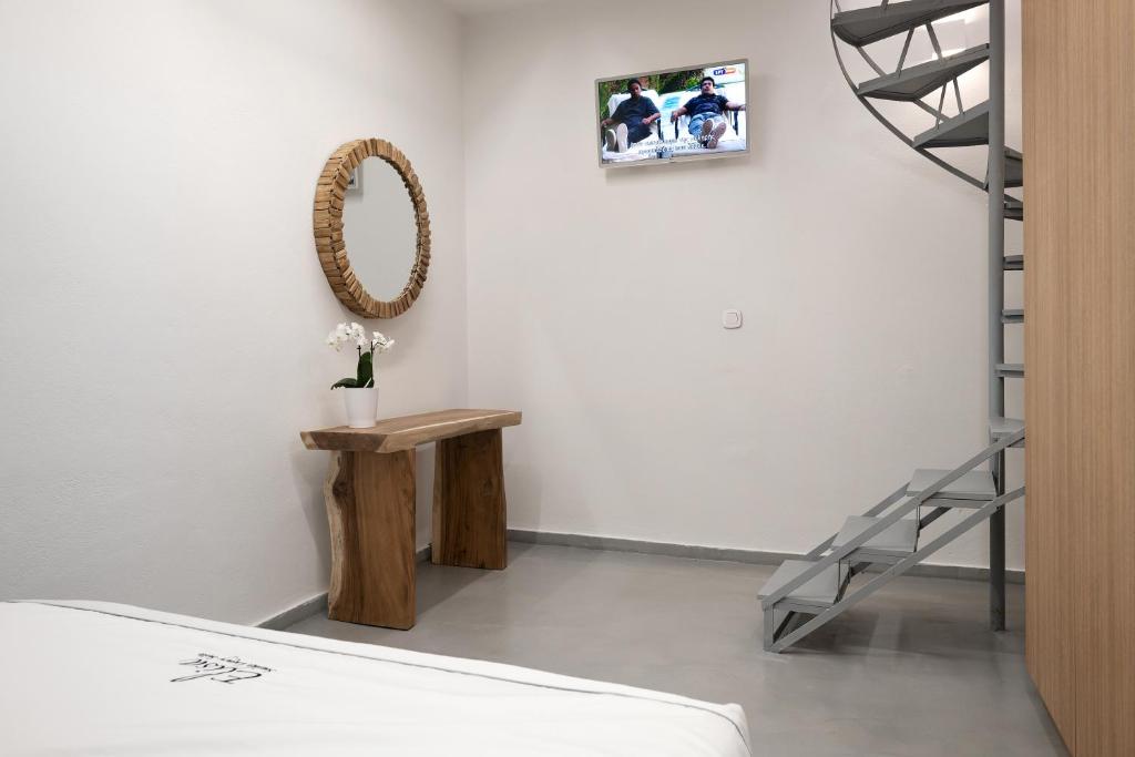 Postel nebo postele na pokoji v ubytování Elisa Seaside Luxury Suite