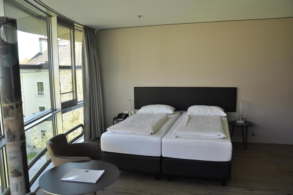 Postel nebo postele na pokoji v ubytování Parkhotel Hall in Tirol