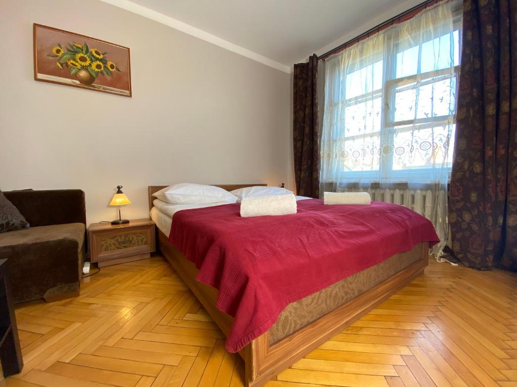 Postel nebo postele na pokoji v ubytování P&J Apartments Floriańska