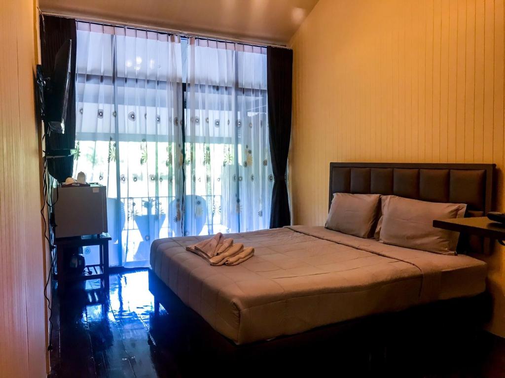 Postel nebo postele na pokoji v ubytování Binlha Raft Resort