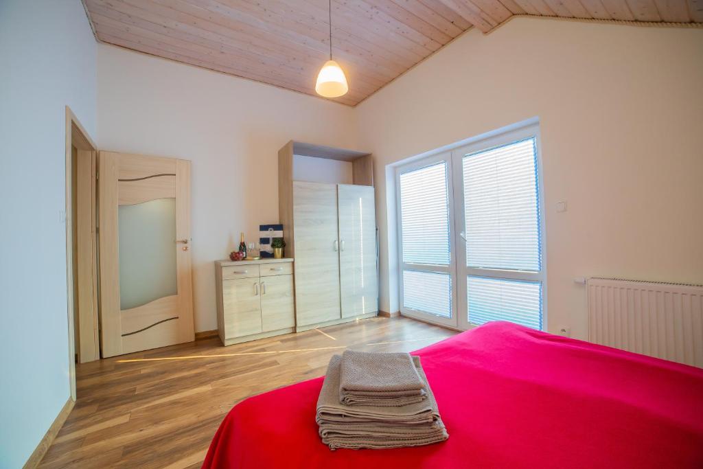 Posteľ alebo postele v izbe v ubytovaní Rellim Apartamenty